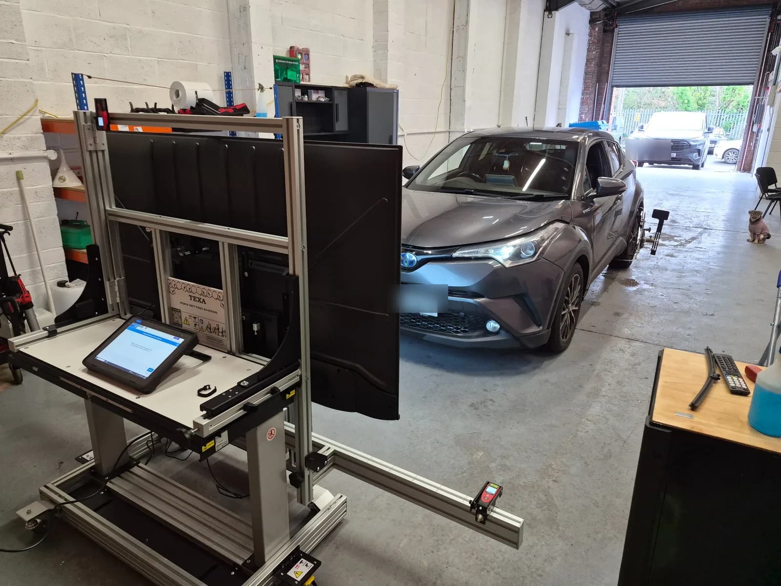 TEXA RCCS equipment positioned for static ADAS calibration in the Horizon workshop.