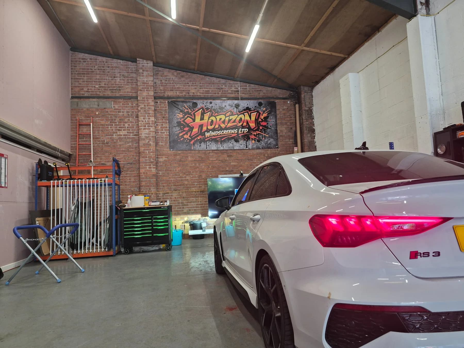 Modern vehicle inside the Horizon Windscreens Cardiff workshop.