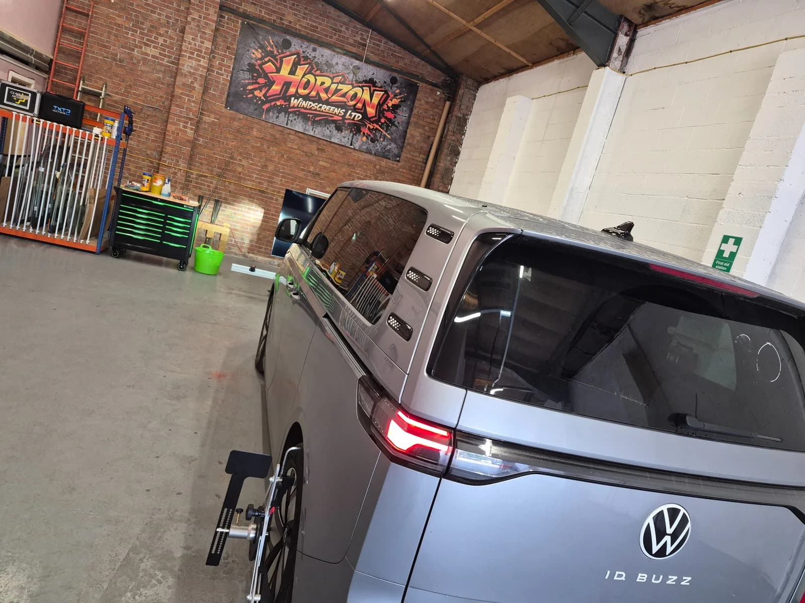 Modern vehicle positioned inside the Horizon Windscreens workshop.